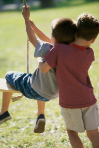Picture of boys playing on a swing
